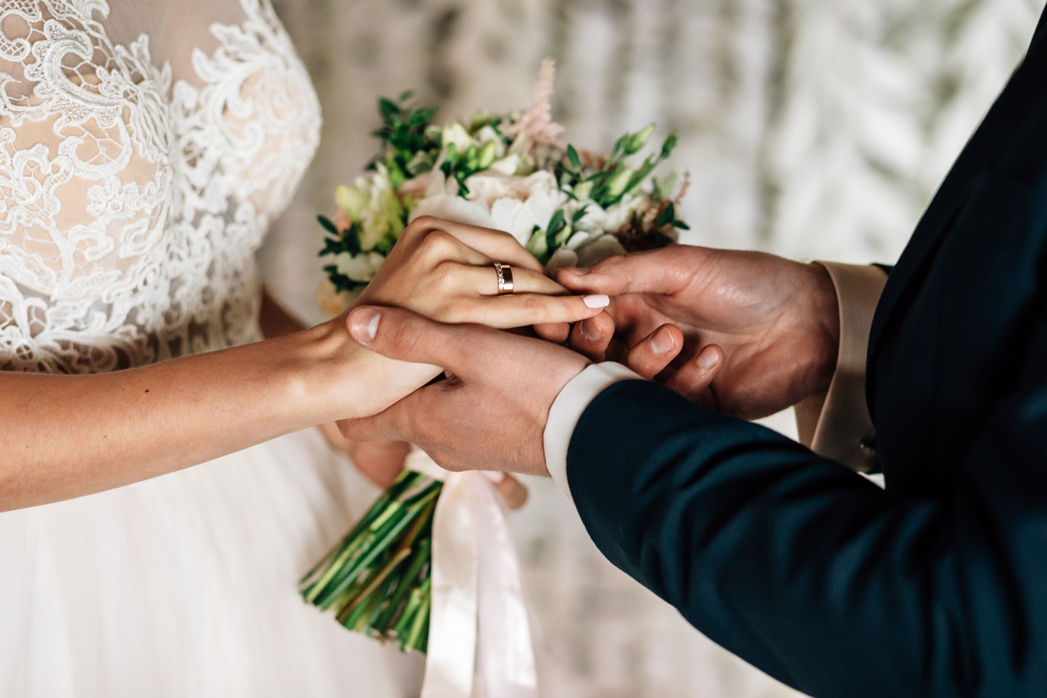 Weddings - Groom taking the hand of his bride