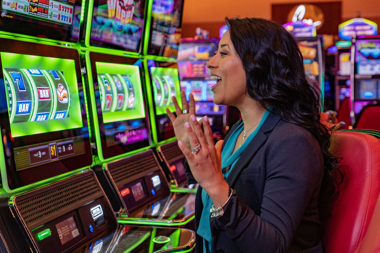 Woman enjoying her time at the slot machines