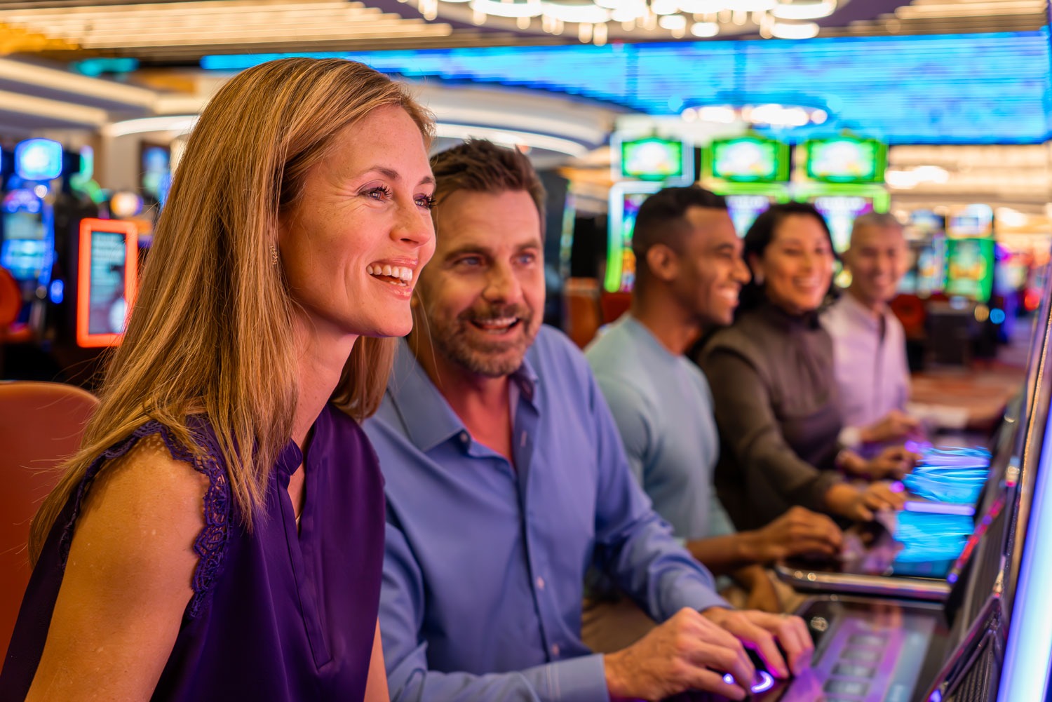 New Members - Join Today - A couple enjoying their time at the slot machines