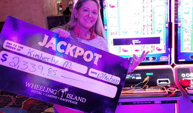 Winners - Jackpot winner with check for $2,339.85