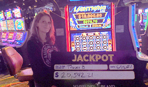 Winners - Jackpot winner with check for $20,542.21